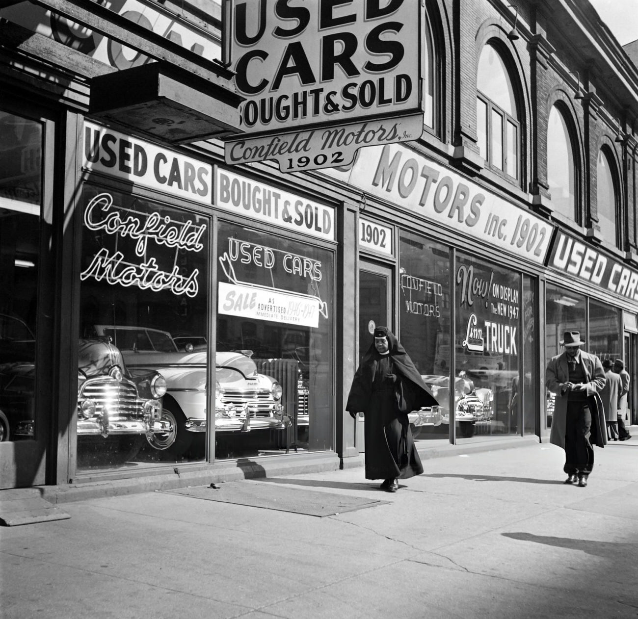 An Afro-American Nun Walks On A Sidewalk Of Broadway, 1947.