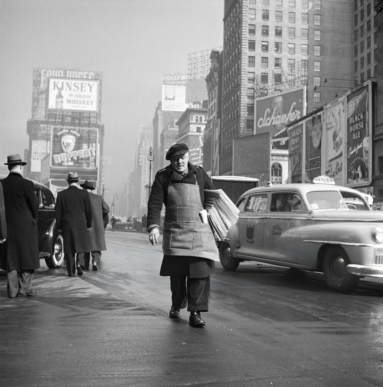 A Delivery Man Carries Newspapers On Broadway, Manhattan, 1947.