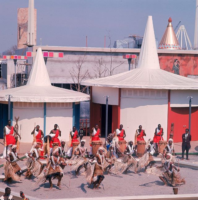 Dancers In Traditional Costumes Outside The African Pavilion.