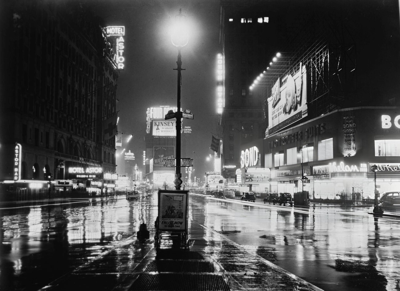 Traffic Passing Neon Signs Illuminating Times Square At The Intersection Of Broadway And 7Th Avenue In Midtown Manhattan, 1946.