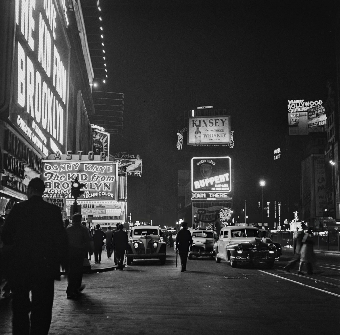 Pedestrians Passing Cars And Taxis Outside The Astor Theatre At 1537 Broadway At The Intersection With West 45Th Street At Times Square, Midtown Manhattan, 1946.