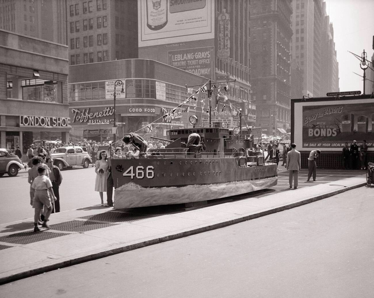 A U.s. Navy Destroyer Mockup Acts As A Recruiting Station Beside A &Amp;Quot;Buy War Bonds&Amp;Quot; Billboard Poster During World War Ii, Times Square, 1940S.