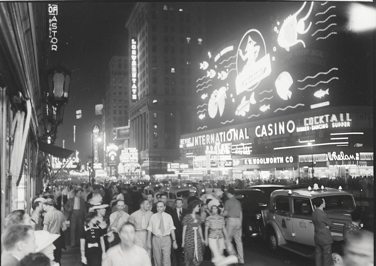 Pedestrians And The Wrigley Sign On Times Square Outside The International Casino, 1940S.