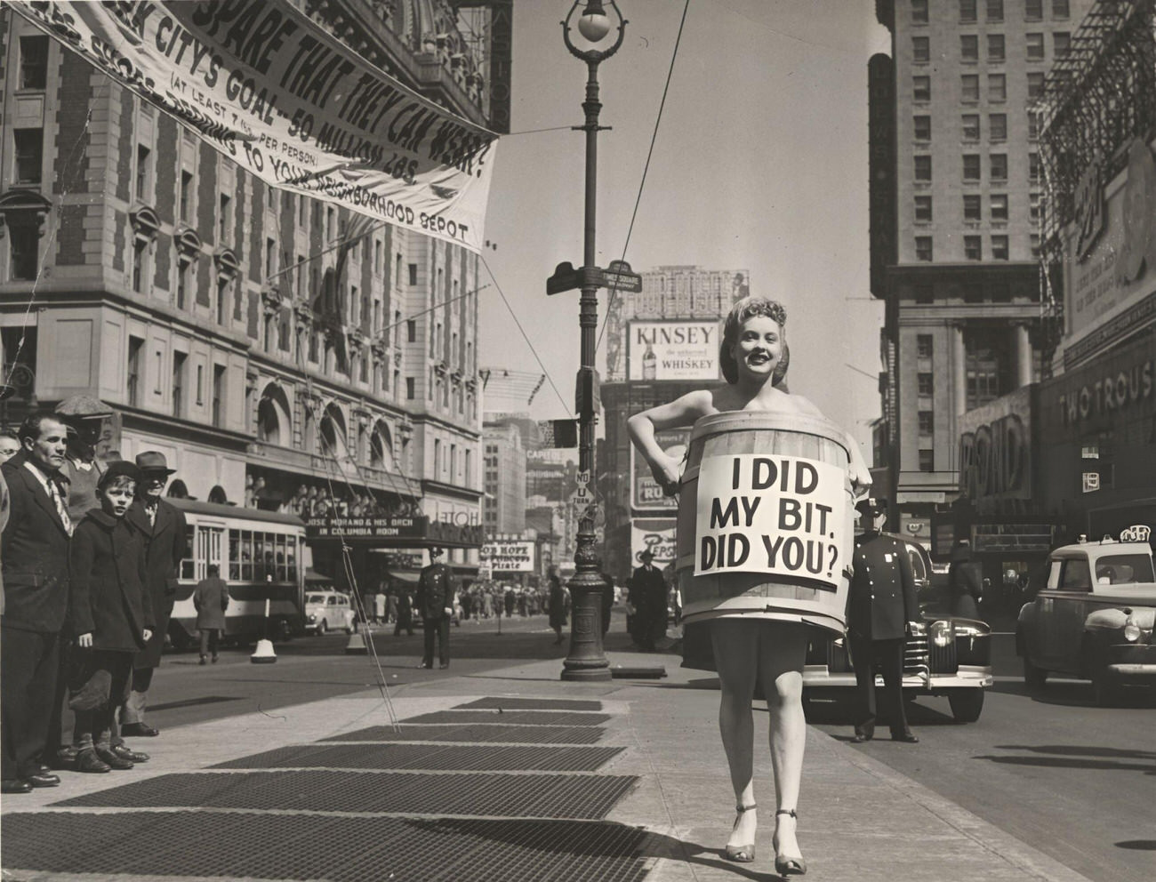 An Unidentified Woman, Dressed In High Heels And A Wooden Barrel That Reads &Amp;Quot;I Did My Bit, Did You?&Amp;Quot;, Walks In Times Square, 1945.