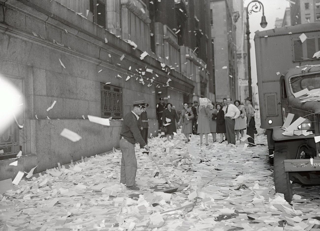 A Street Sweeper Cleans Up After The V-E Day Celebration In New York City.