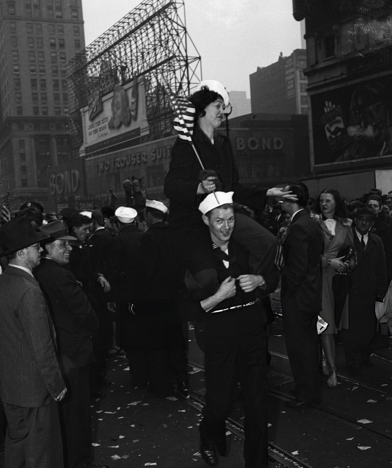 A Woman Is Being Carried On A Man'S Shoulders To Celebrate V-E Day In New York City In Times Square, 1945.