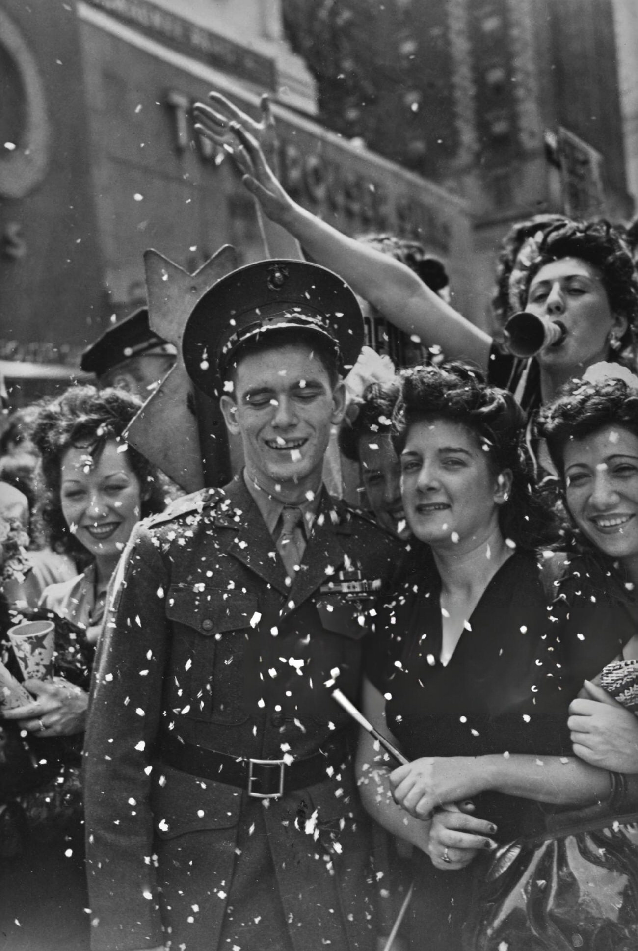 A Uniformed Military Officer, His Eyes Closed As He Is Showered With Confetti Among Women During The Victory In Europe Celebrations, At The End Of The Second World War, 1945.