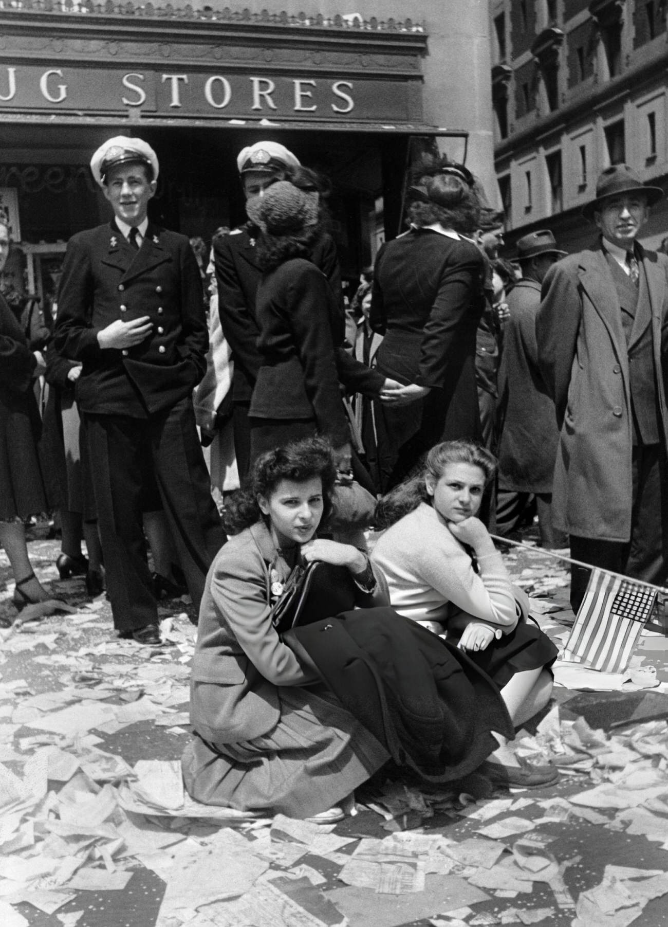 Two Women Rest On The Ground During The Ve-Day Celebrations, 1945.