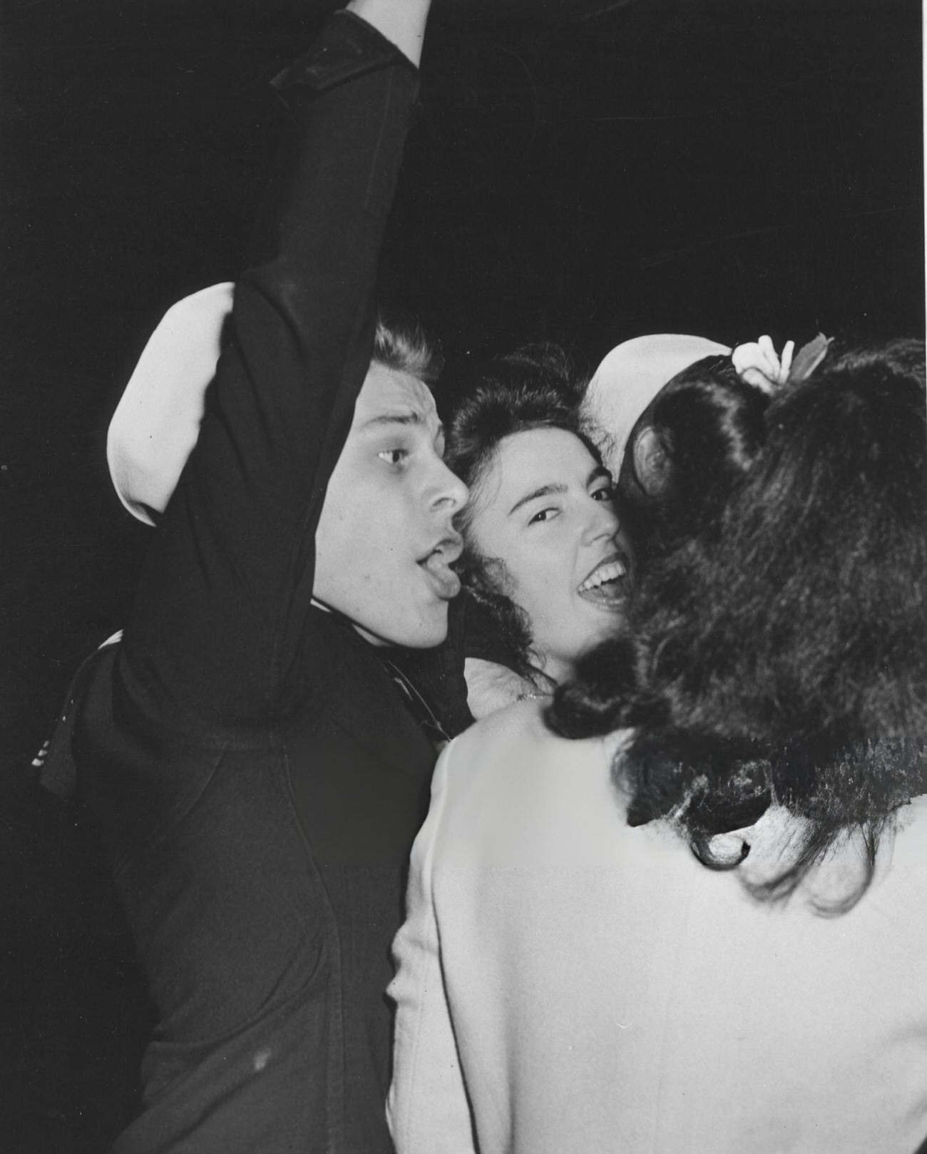 A Uniformed Sailor And Two Women Celebrate Ve Day, 1945.