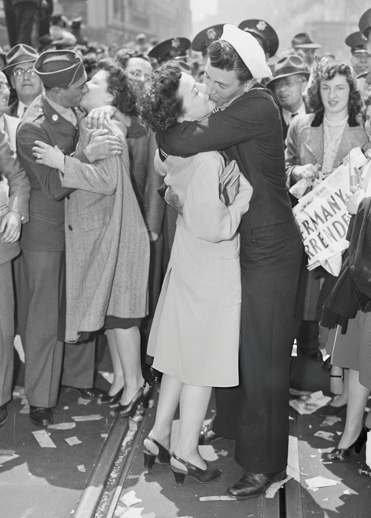 Women Are Kissed By Us Military Men In Times Square While Watched By A Celebrating Crowd On V-E Day, 1945.