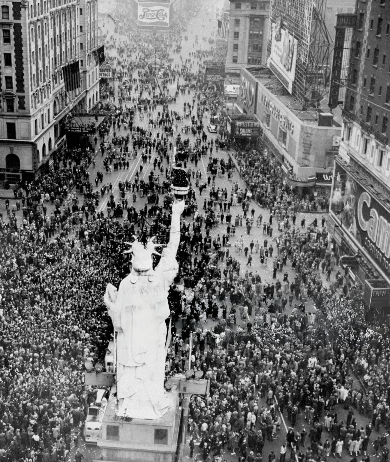 Crowds Surround A Replica Of The Statue Of Liberty Celebrating V-E Day In Times Square, 1945.