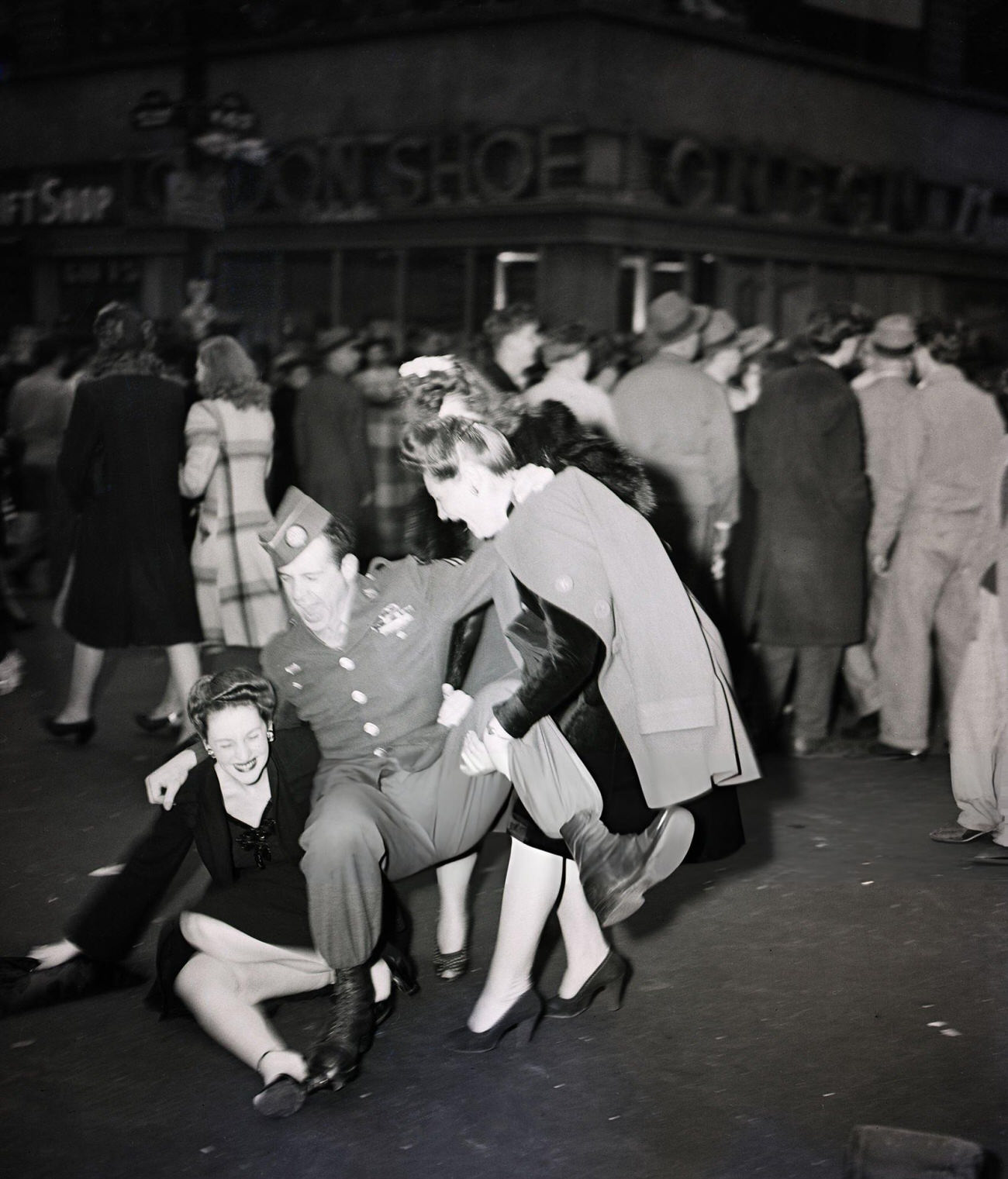 An Elated Trio Fall To The Ground On V-E Day, 1945.