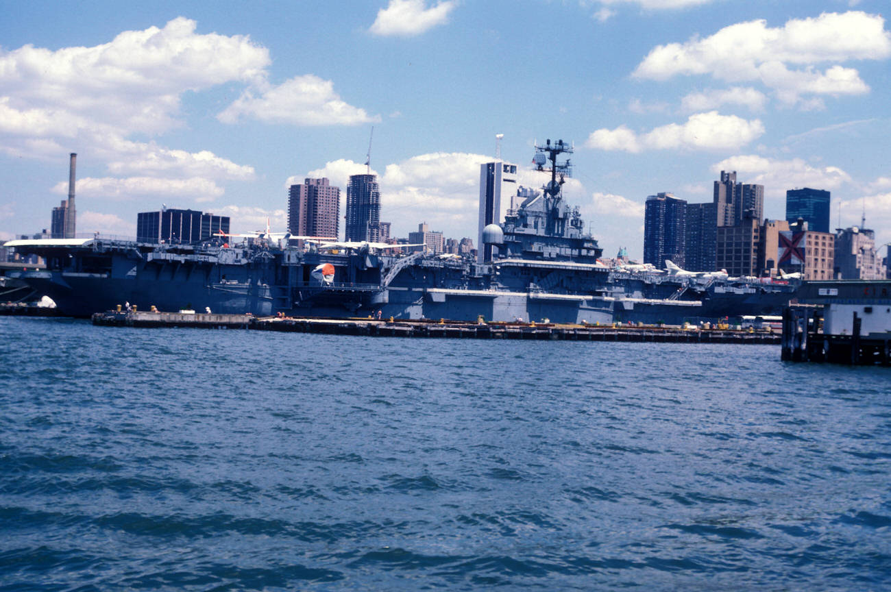 A View Of The Intrepid Sea-Air-Space Museum And The City Skyline, 1983.