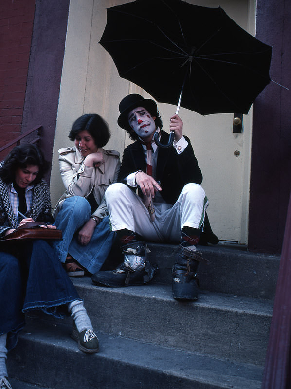 A clown visiting two girls, Manhattan, 1978.