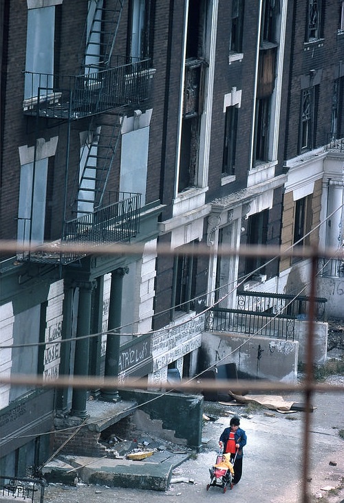 A woman with a baby stroller in the Bronx, Upper Manhattan, 1978.