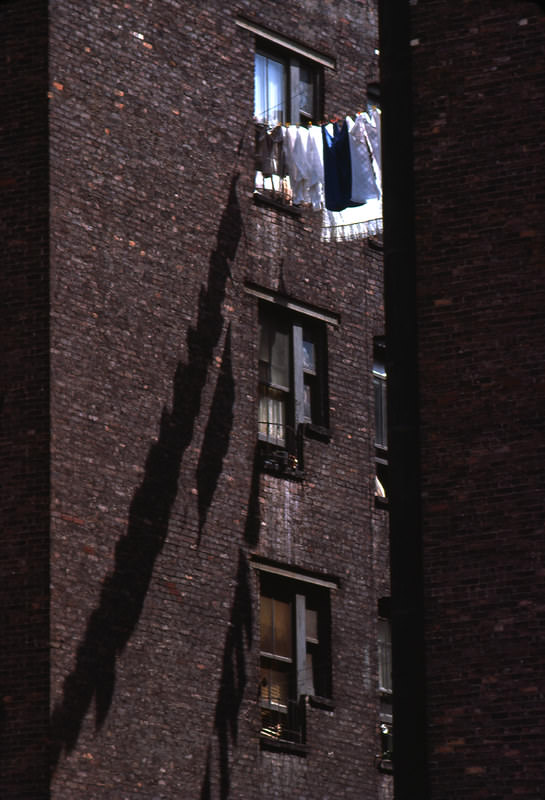 Clothing hanging between brick walls in Manhattan, 1978.