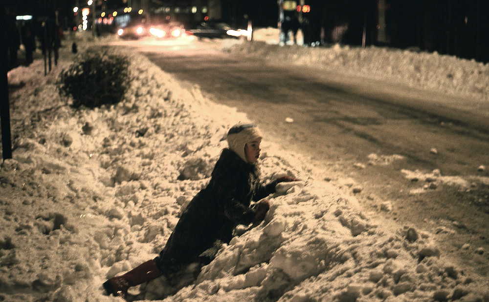 A kid on a snowy street in Manhattan, 1978.