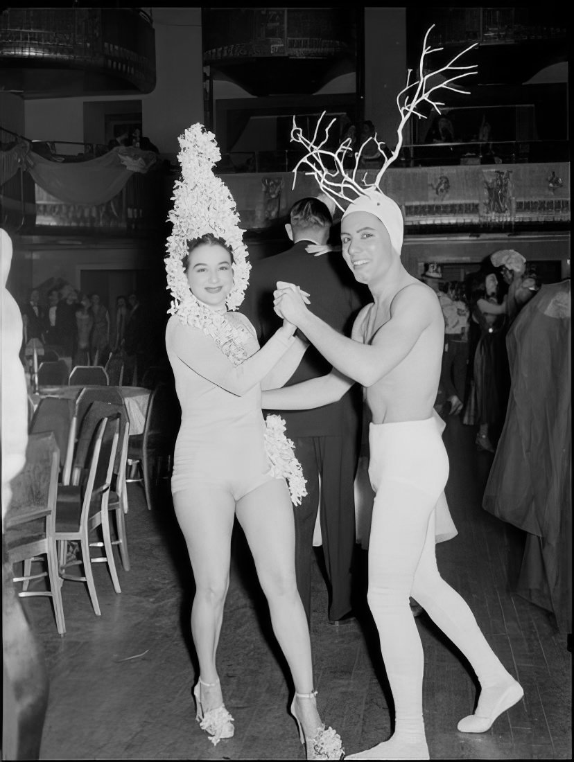 A couple with elaborate headpieces dancing, 1951.