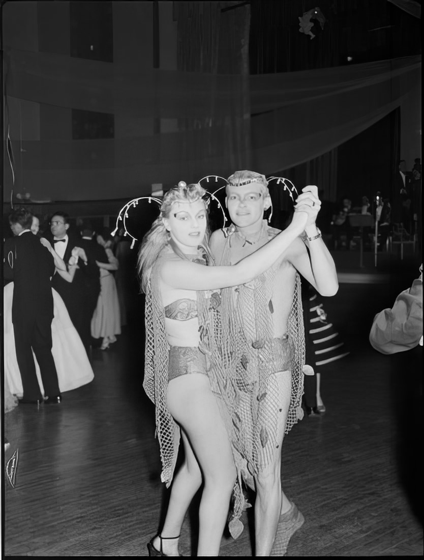 A couple with elaborate headpieces dancing, 1951.