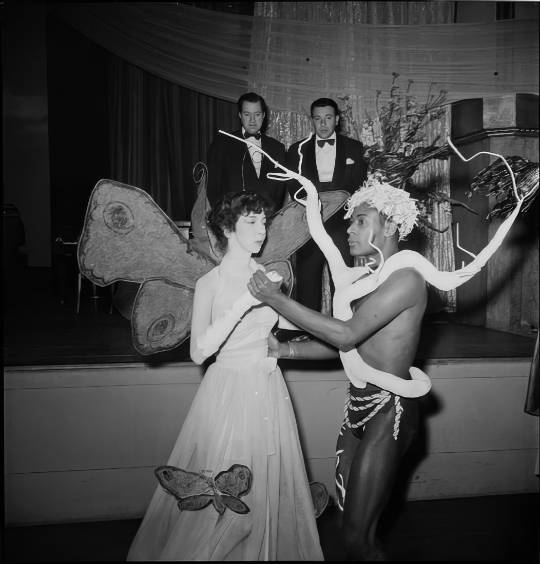 A dancing couple wearing elaborate costumes, 1951.