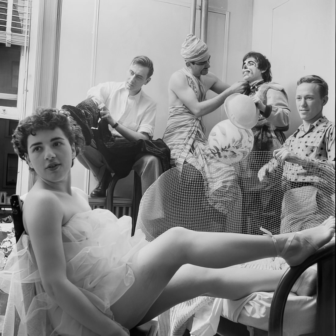 A group of people preparing for the ball, 1951.