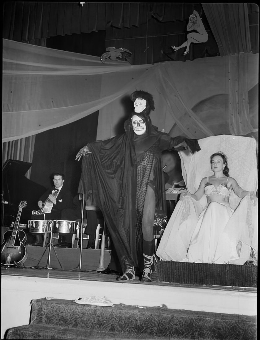 A costumed person leaving the stage, 1951.