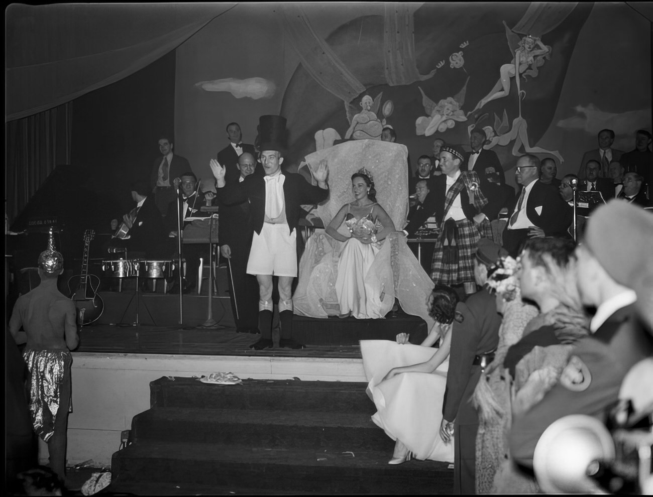 A man speaking to the guests from the stage, 1951.