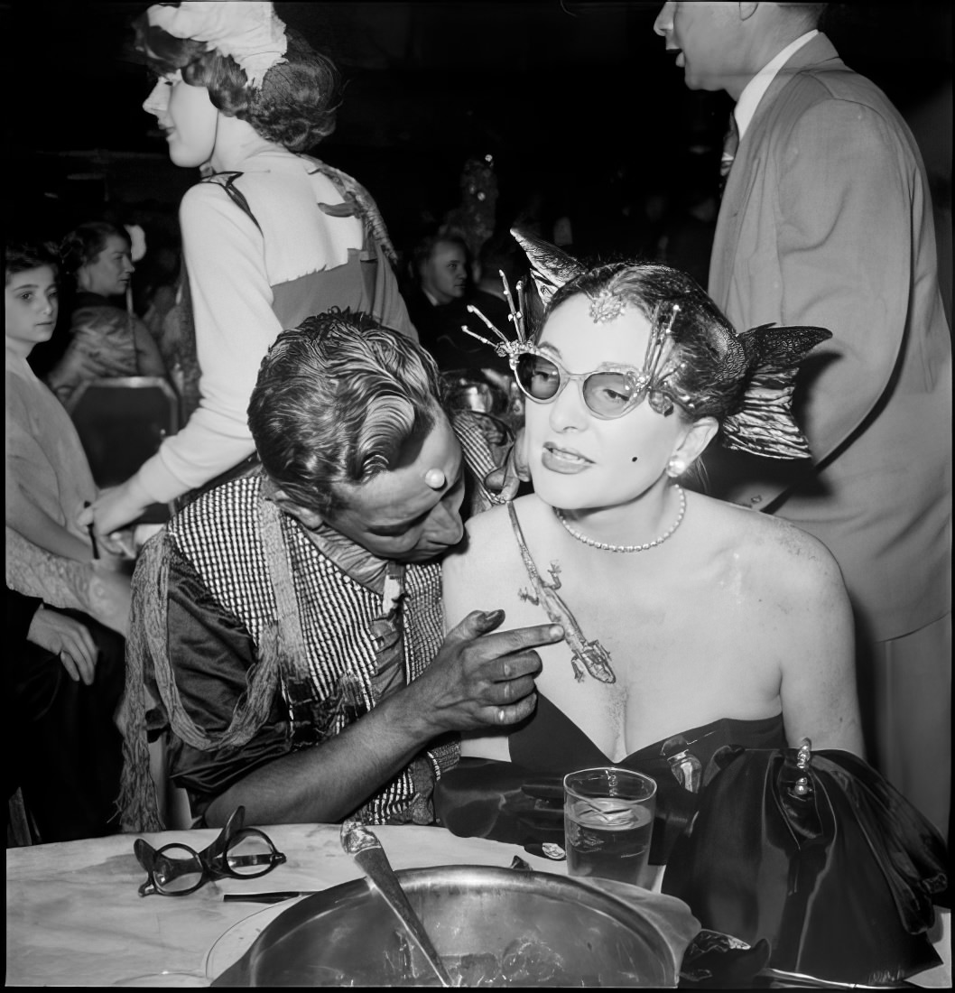 A man touching a lizard on a woman's chest, 1951.