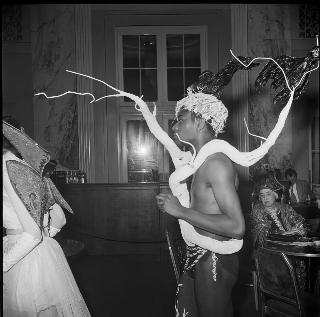 A man wearing an elaborate costume, 1951.