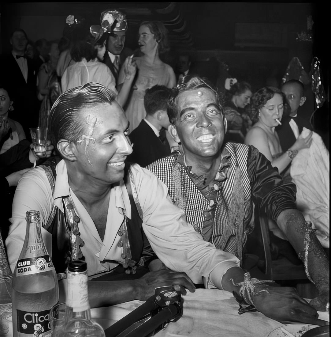 Men in costume sitting at a table, 1951.