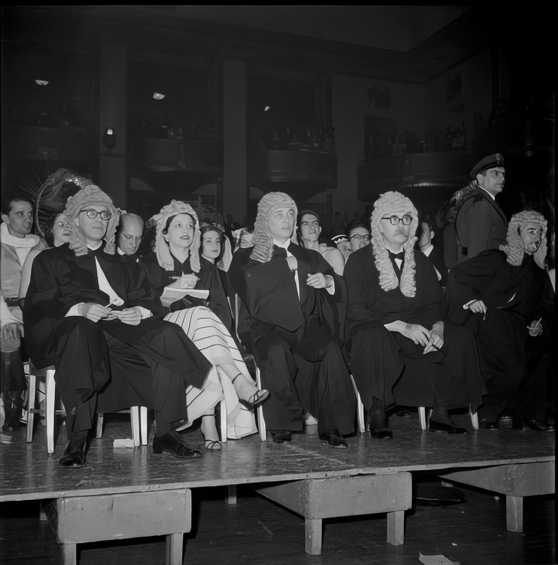 People dressed as judges sitting on a stage, 1951.