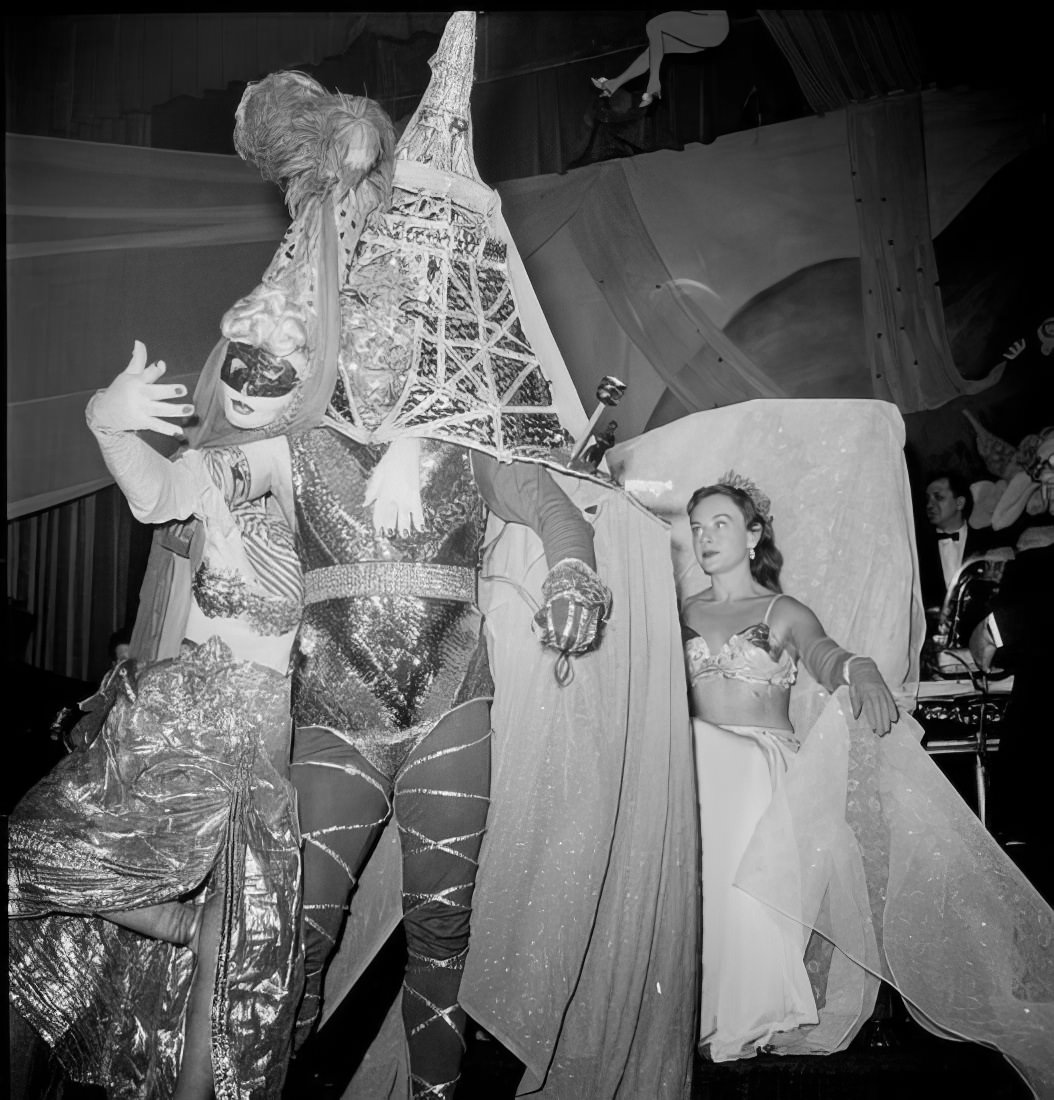 People in an elaborate costume, 1951.