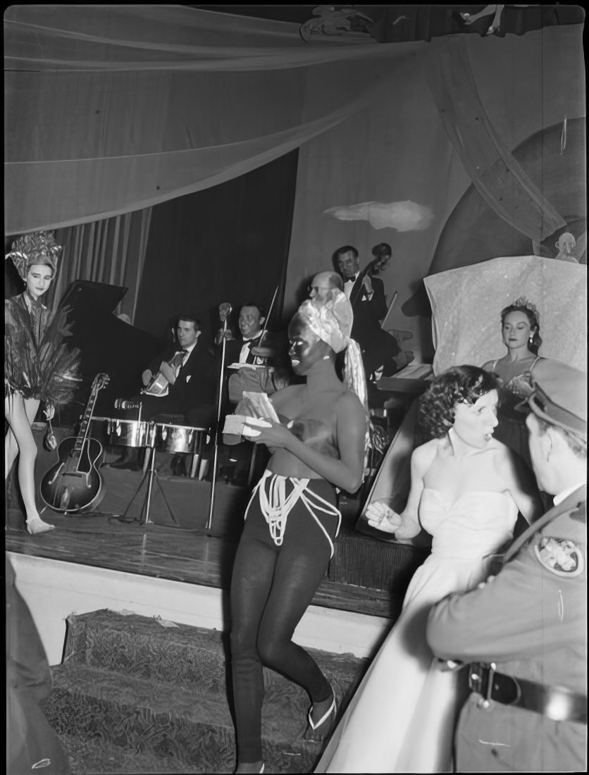 Women in costume leaving the stage, 1951.