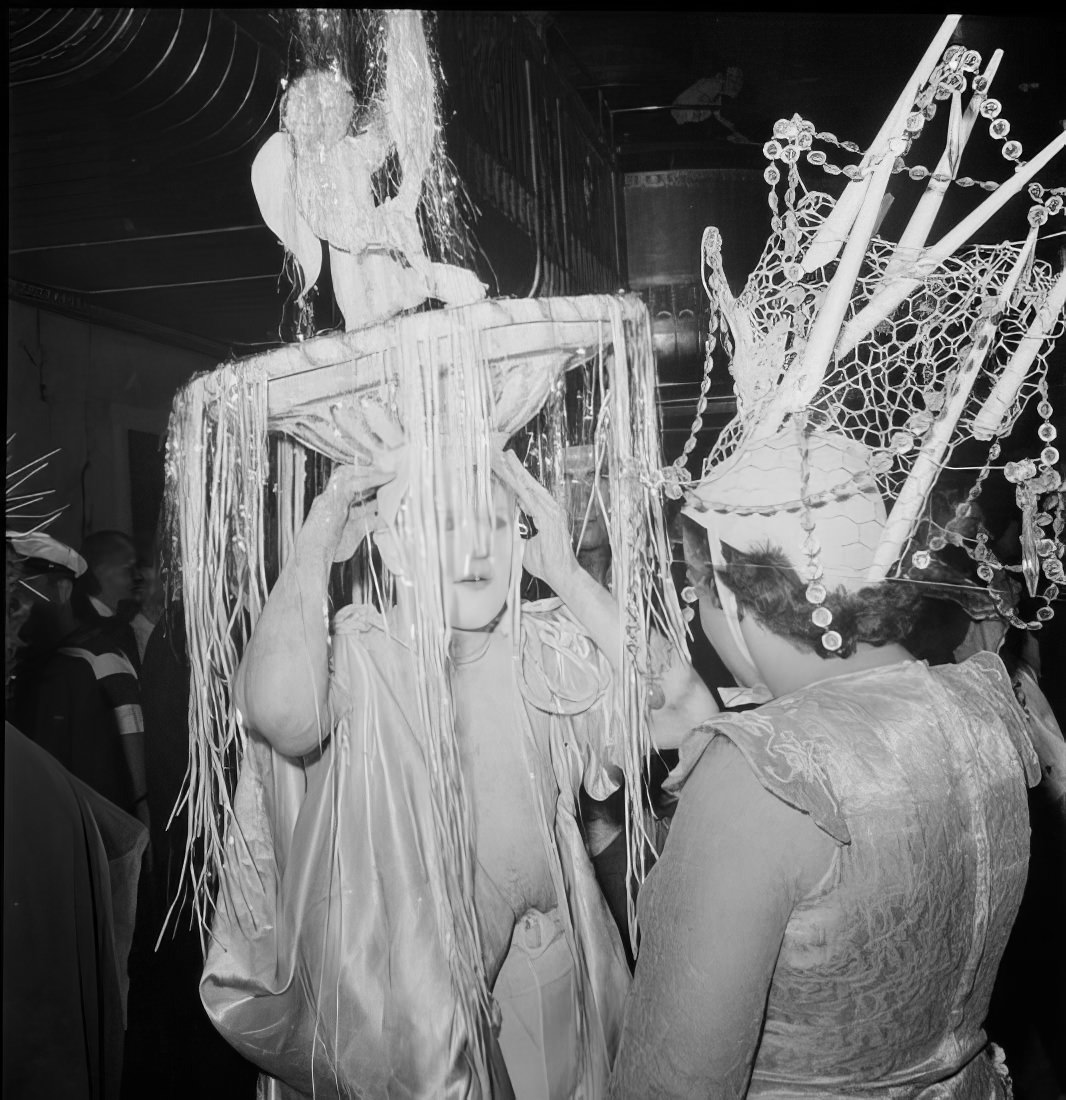 Women in elaborate headpieces, 1951.