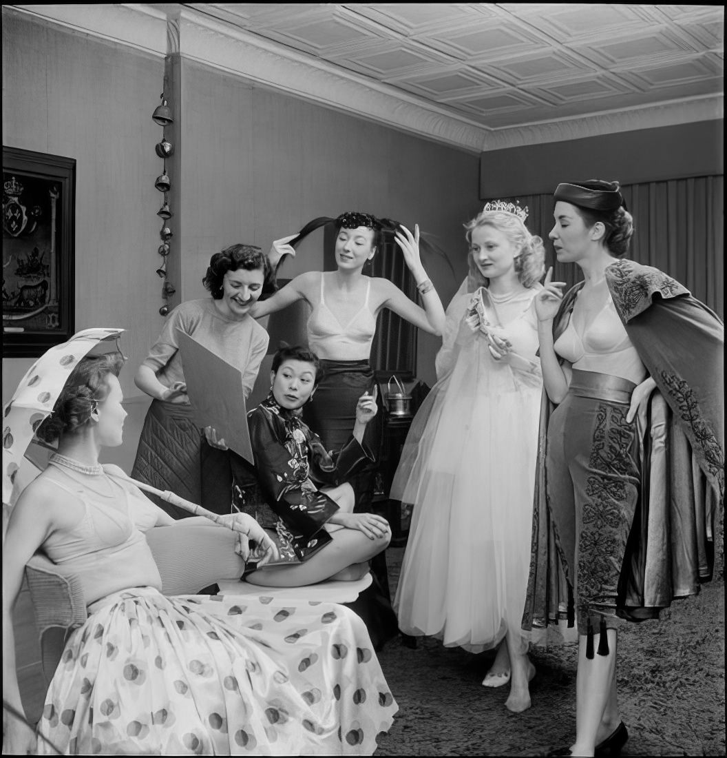 Women talking as they prepare for the ball, 1951.