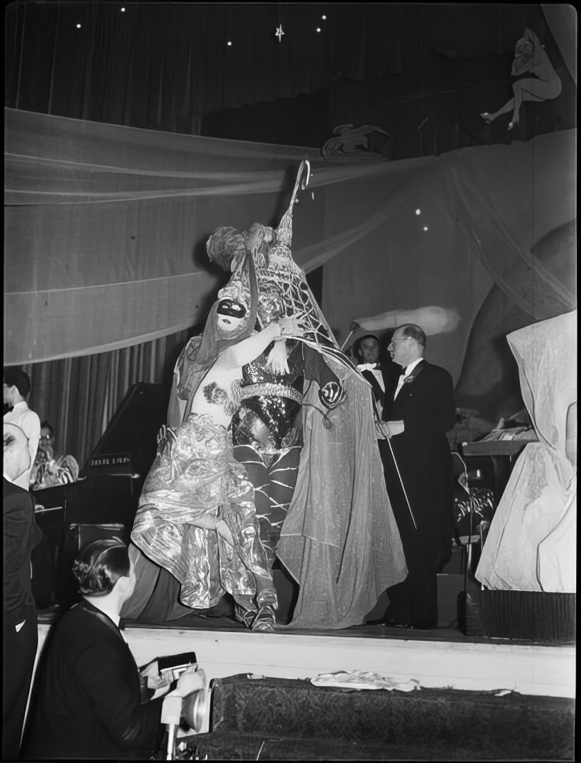 People in elaborate costumes, 1951.