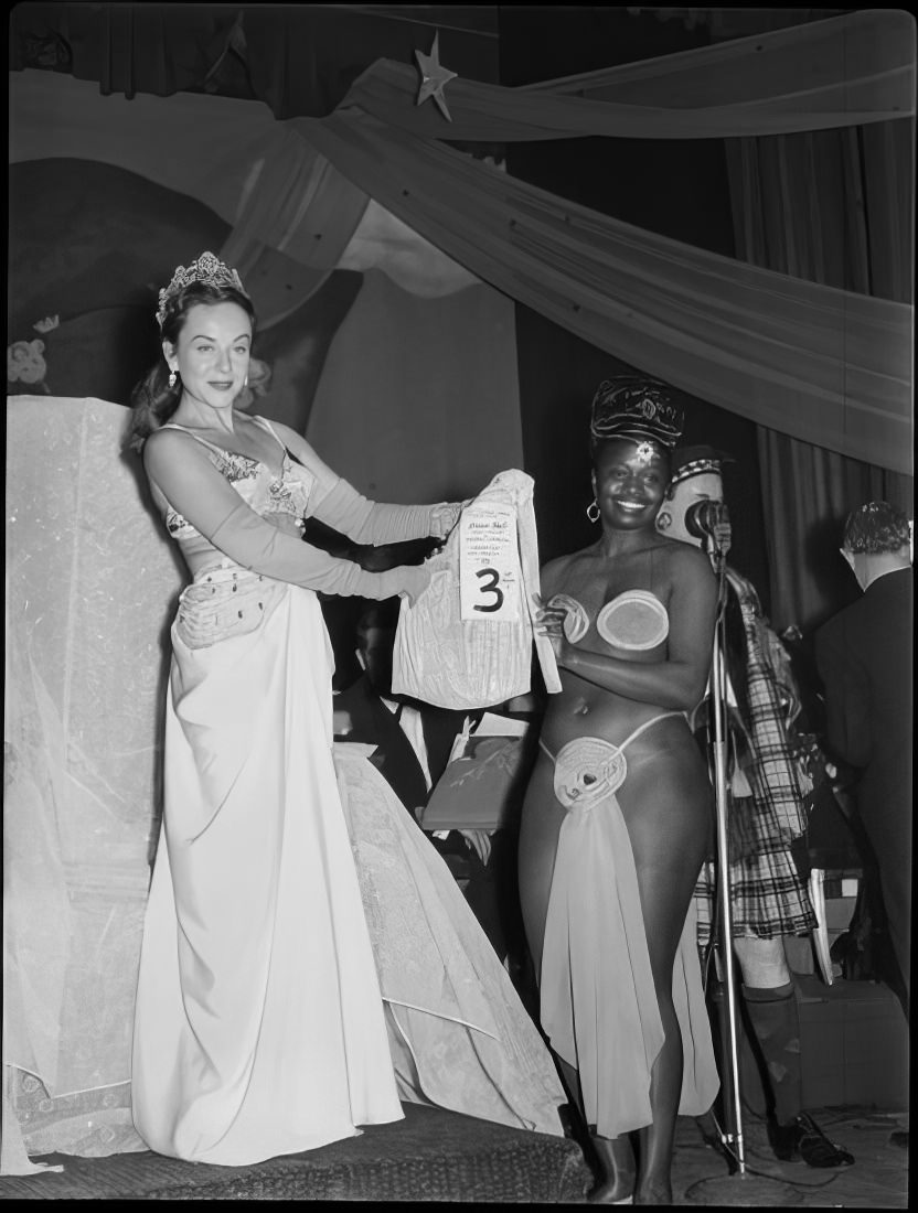 A woman receiving the 3rd place prize for the best costume, 1951.