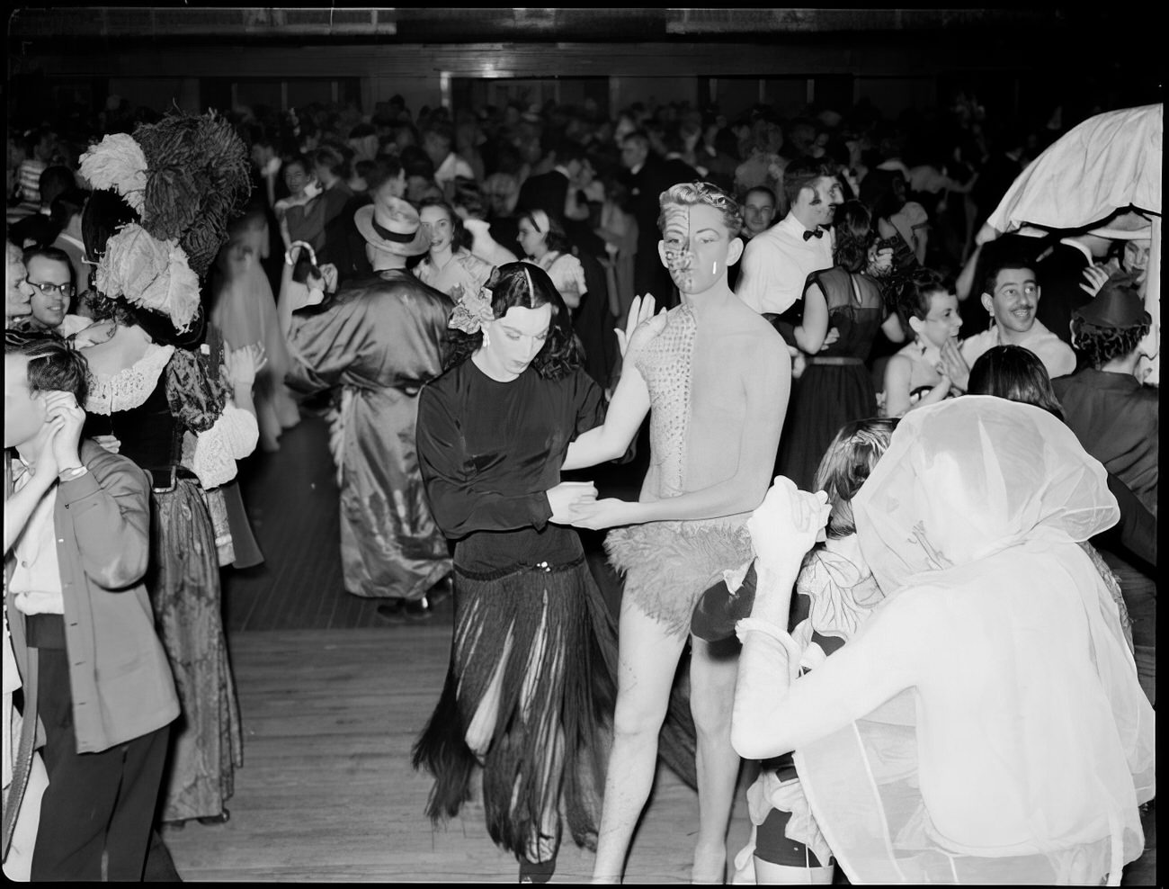 A costumed couple dancing, 1951.