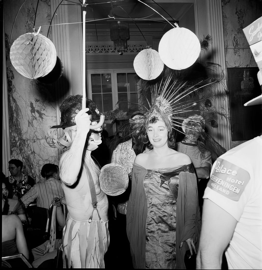 Ball guests in elaborate costumes, 1951.