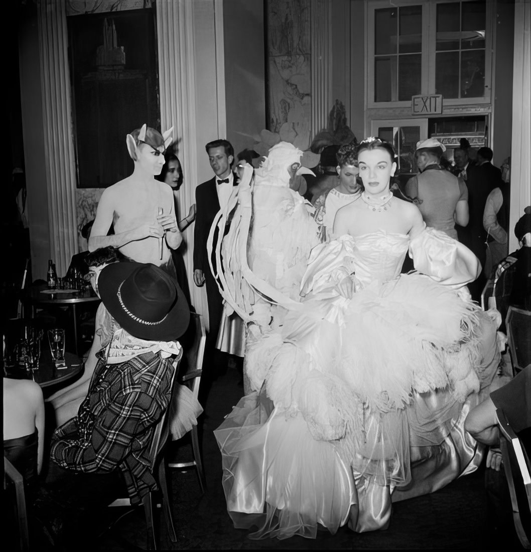 Ball guests in elaborate costumes, 1951.