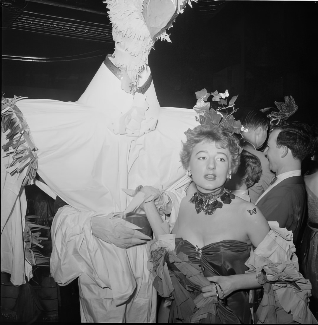 Ball guests in elaborate costumes, 1951.