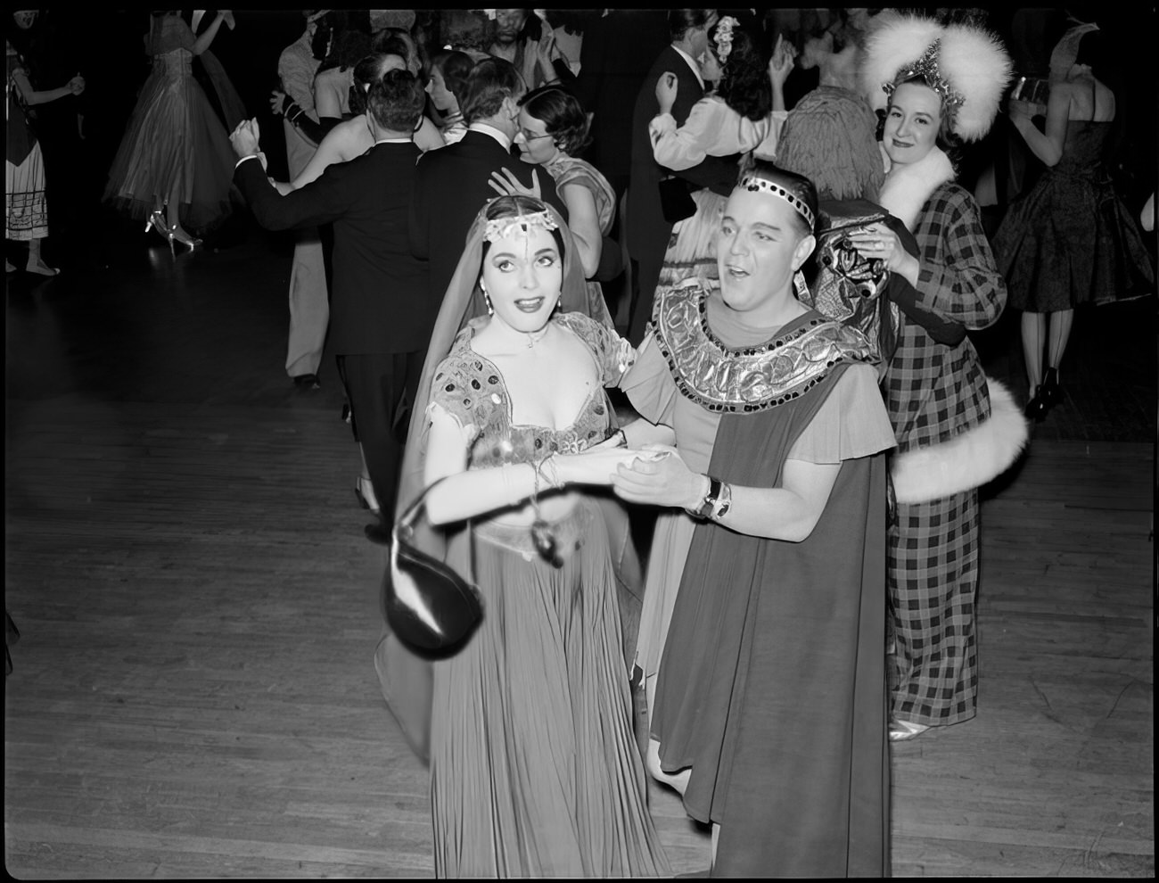 A costumed couple dancing, 1951.