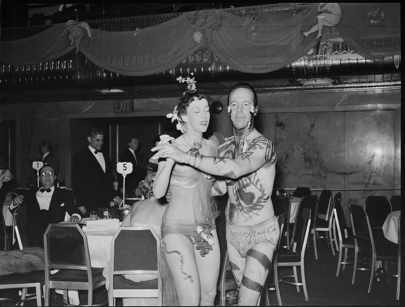 A costumed couple dancing, 1951.