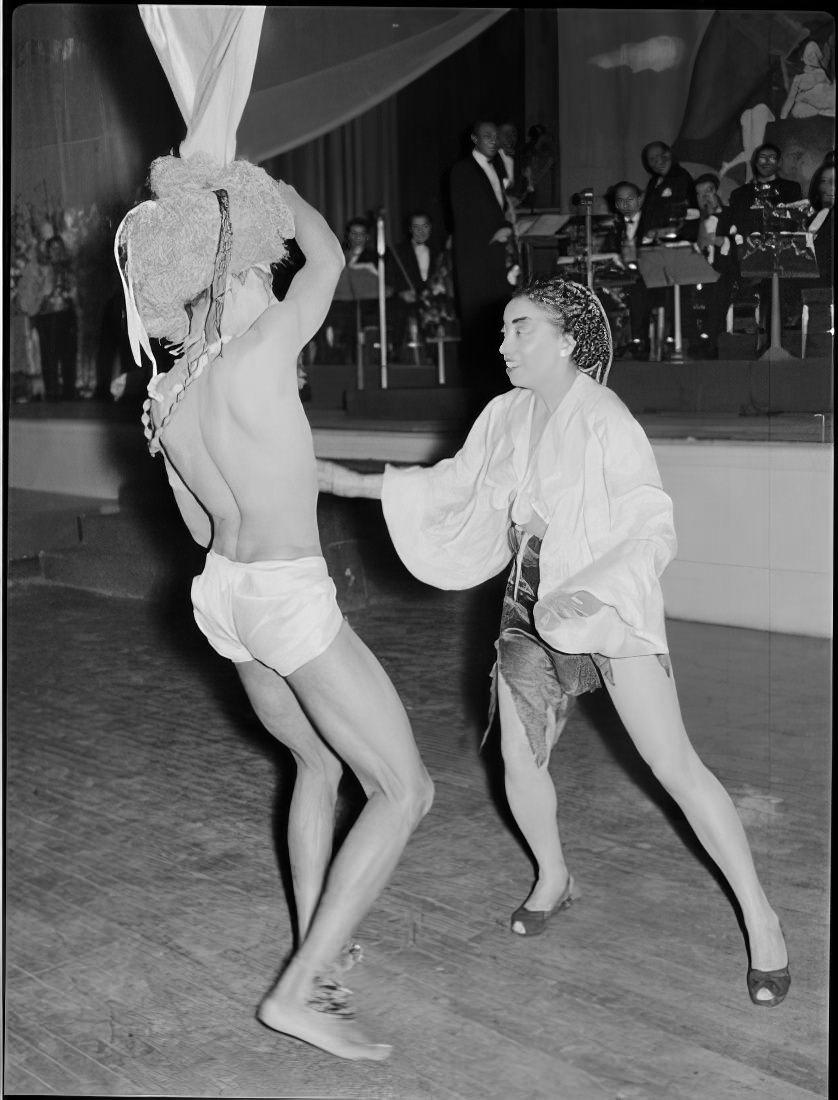 A costumed couple dancing, 1951.