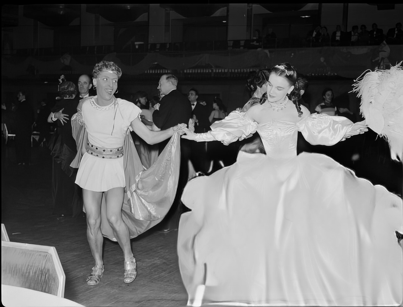 A costumed couple dancing, 1951.