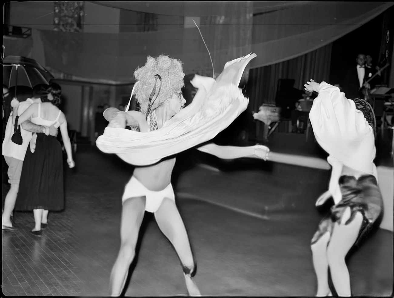 A costumed couple dancing, 1951.