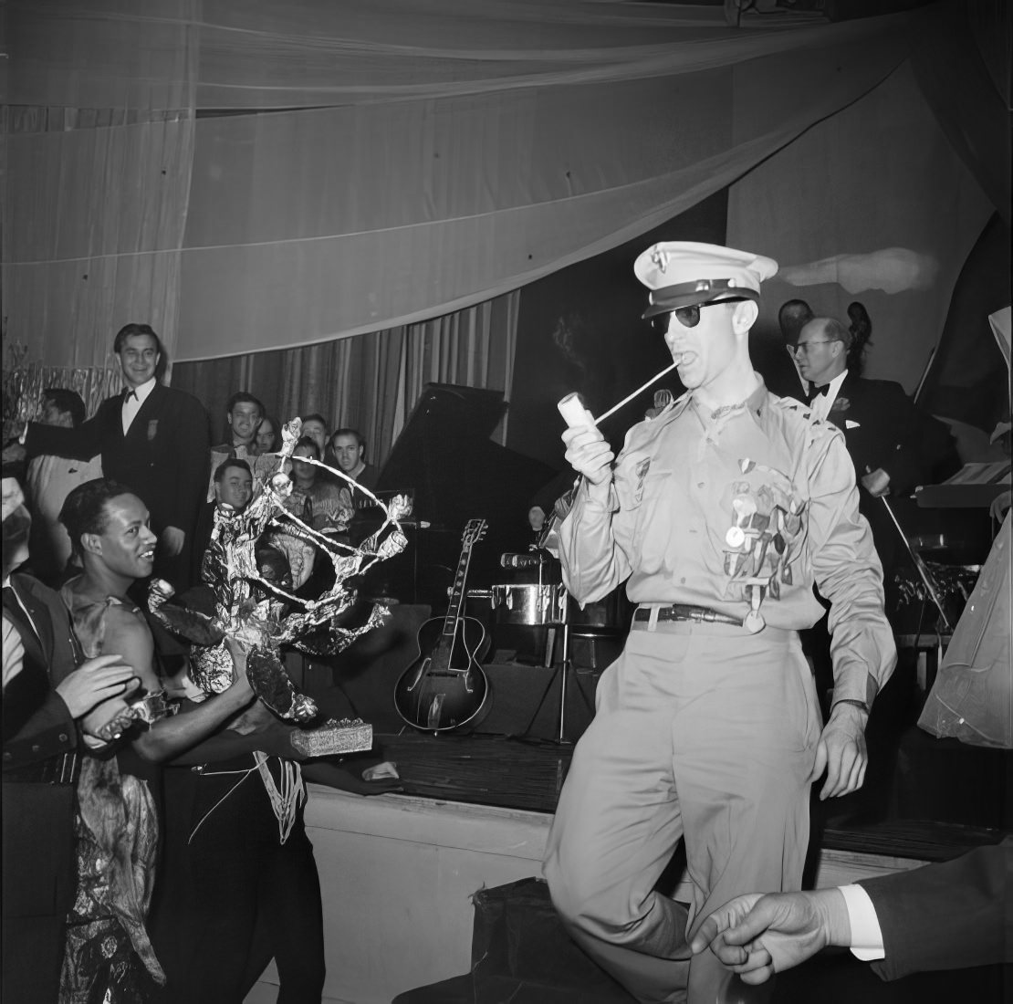 A costumed man leaving the stage, 1951.