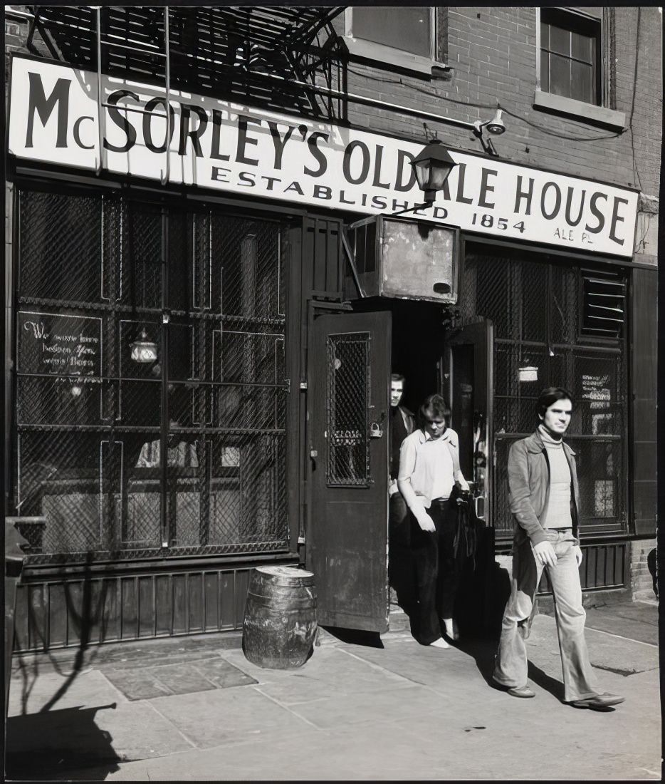 Men leaving McSorley's Old Ale House at 15 East 7th Street, 1978.