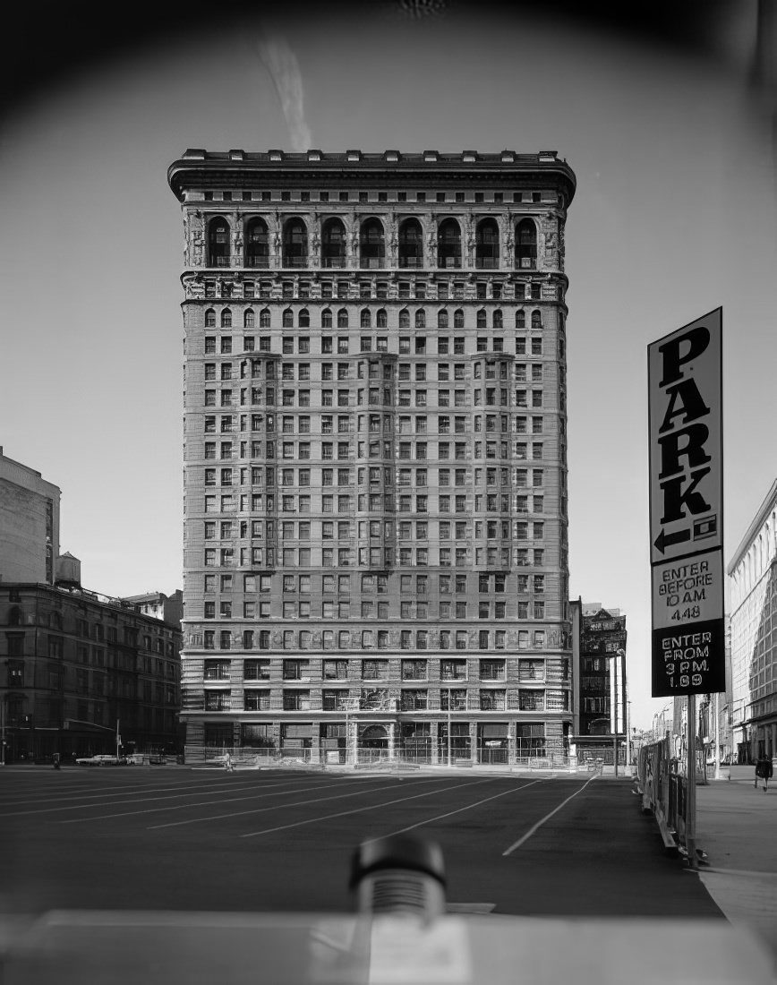 Looking west across a parking lot to the Flatiron Building at 949 Broadway, 1977.