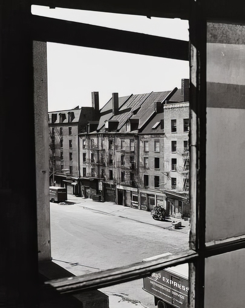 Looking southeast through a window toward Schermerhorn Row, 1975.